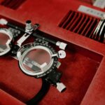 Close-up of an optometry diagnostic tool set in a red case, emphasizing precision.